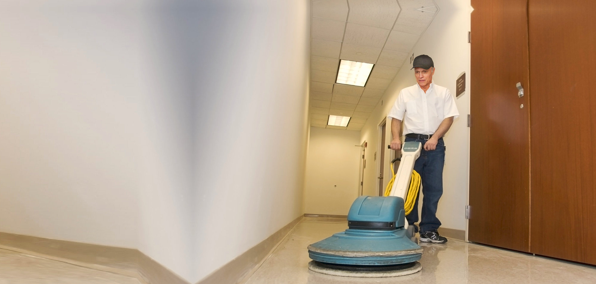 man cleaning the hallway